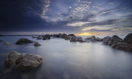 Scenic view of sea against sky at sunset