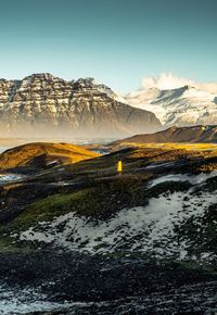 Scenic view of snowcapped mountains against sky