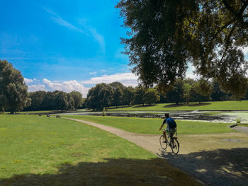 Man riding bicycle at park