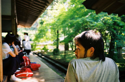 Rear view of man at railroad station platform