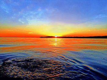 Scenic view of sea at sunset