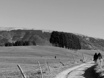 View of landscape with mountain range in background