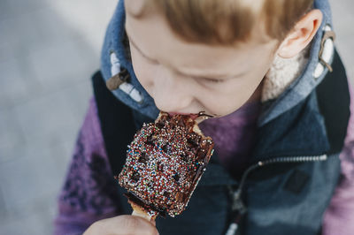 Close-up of cute boy eating waffle