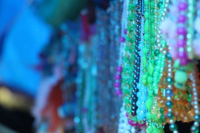 Close-up of multi colored ornaments for sale in market