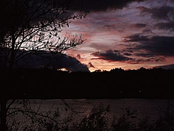 Scenic view of silhouette landscape against sky at sunset