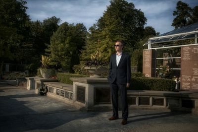 Full length portrait of man standing against trees