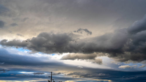 Low angle view of clouds in sky during sunset