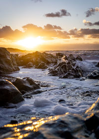 Scenic view of sea against sky during sunset