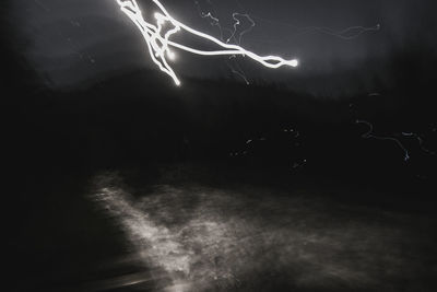 Light trails in sky at night