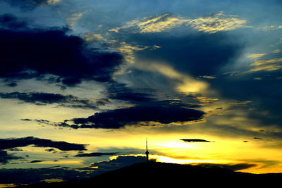 Low angle view of dramatic sky during sunset