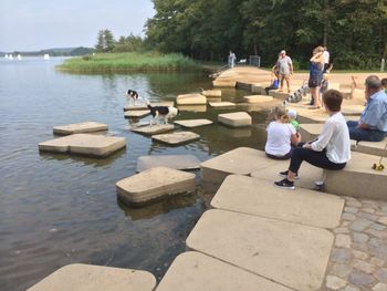 People relaxing in lake