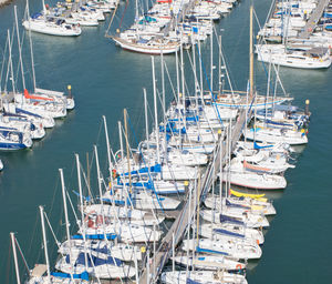 High angle view of sailboats moored at harbor