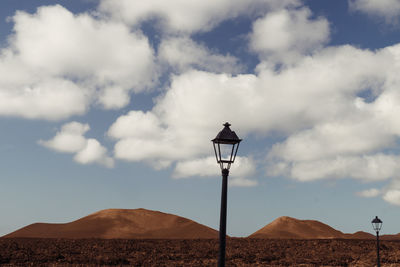 Street light against sky