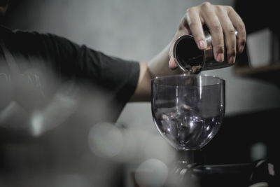 Close-up of wineglass on glass of wine