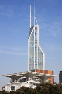 Low angle view of tower against blue sky