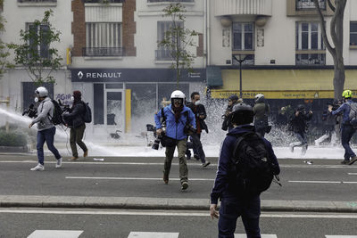 People walking on road in city