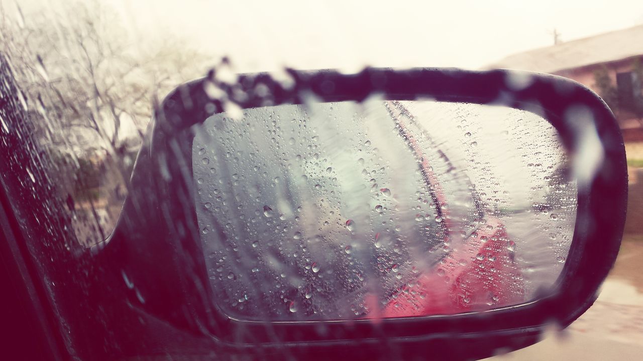 close-up, transparent, drop, transportation, land vehicle, glass - material, car, wet, mode of transport, focus on foreground, water, vehicle interior, rain, window, car interior, side-view mirror, reflection, indoors, raindrop, weather