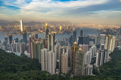 Aerial view of modern buildings in city against sky