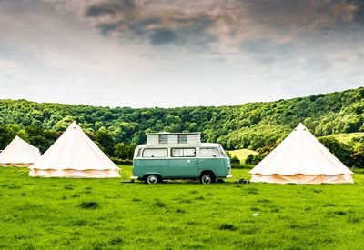 Tent on field against sky