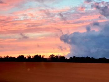 Scenic view of silhouette trees against sky during sunset