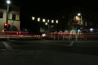 Light trails on road in city at night