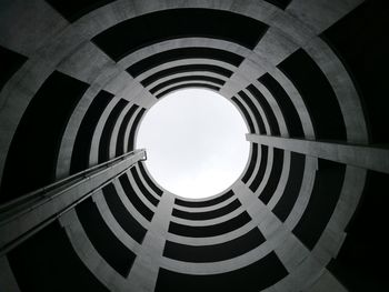 Low angle view of spiral building against sky