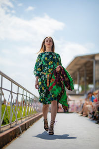 Woman standing on bridge