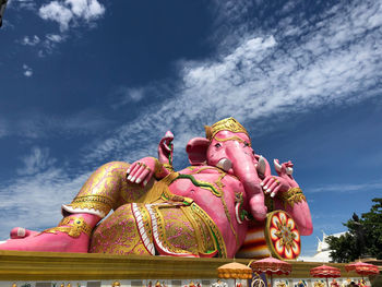 Low angle view of statue against sky