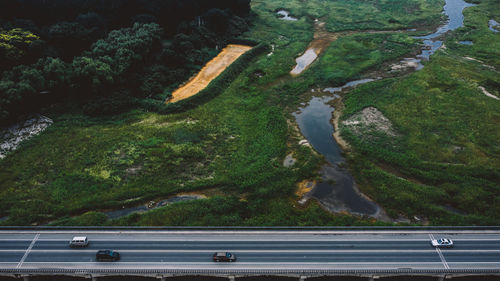 High angle view of road by lake