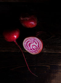 High angle view of strawberries on table against black background