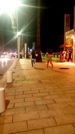 People in city at night