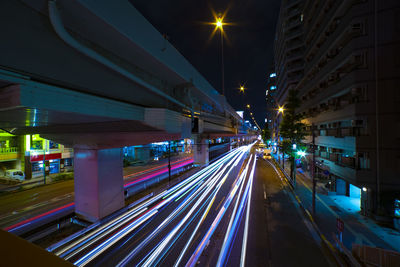 High angle view of light trails on road at night