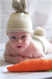Portrait of cute baby boy in bunny costume 