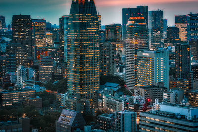 High angle view of illuminated buildings in city against sky