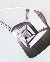 Directly above shot of spiral staircases in building