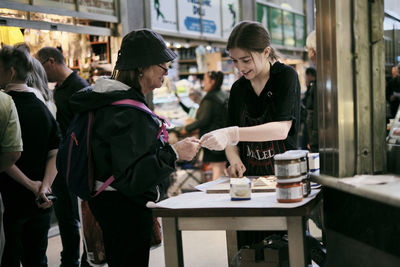 People standing at cafe table