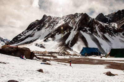 Scenic view of snowcapped mountains against sky