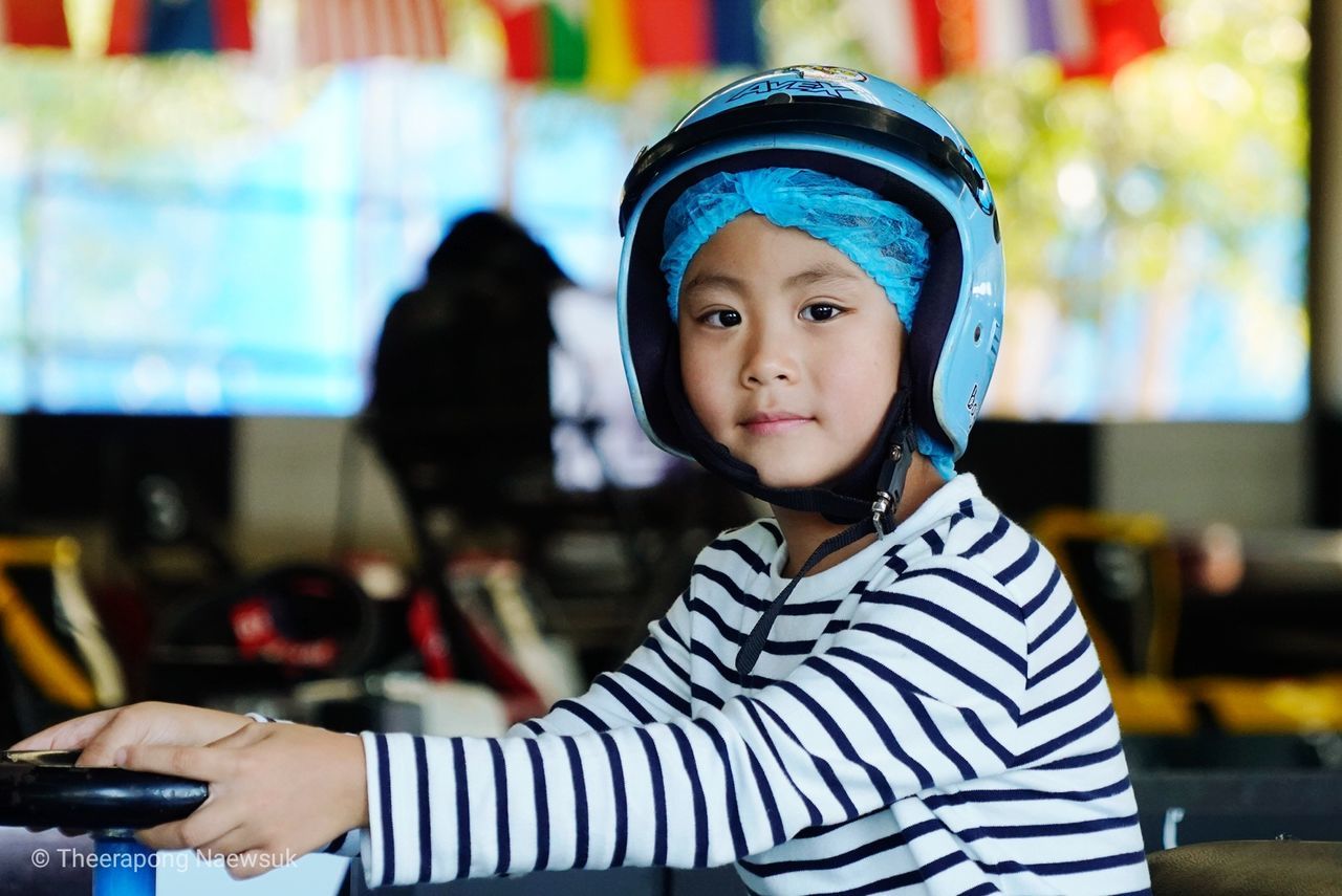 childhood, child, portrait, one person, real people, leisure activity, focus on foreground, casual clothing, lifestyles, striped, looking at camera, men, indoors, cute, innocence, incidental people, boys, front view