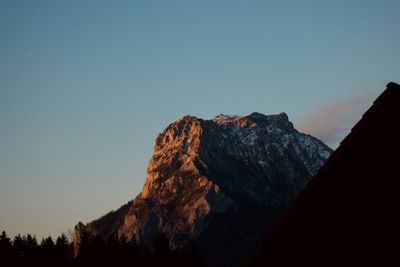 Scenic view of mountains against clear blue sky