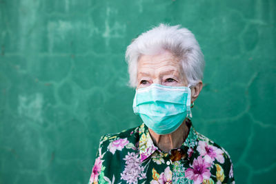 Portrait of woman against blue sky