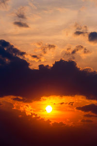 Low angle view of dramatic sky during sunset