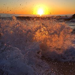 Scenic view of sea against sky at sunset