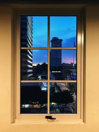 Reflection of buildings on glass window