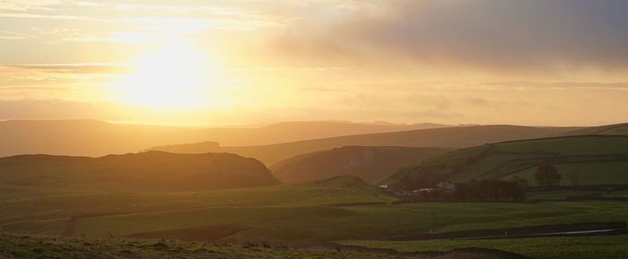 Scenic view of landscape against sky during sunset