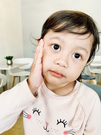 Portrait of cute girl at home