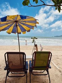 Chairs and lounge chair at beach