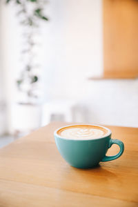 High angle view of coffee cup on table