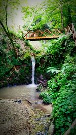 Scenic view of river flowing through rocks