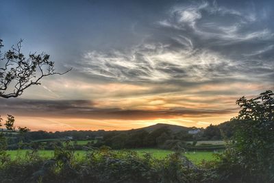 Scenic view of landscape against sky during sunset