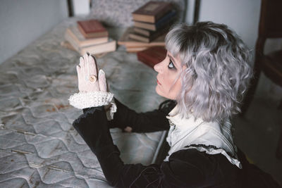 High angle view of woman praying at home